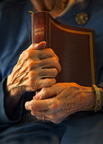 Hands and Bible
